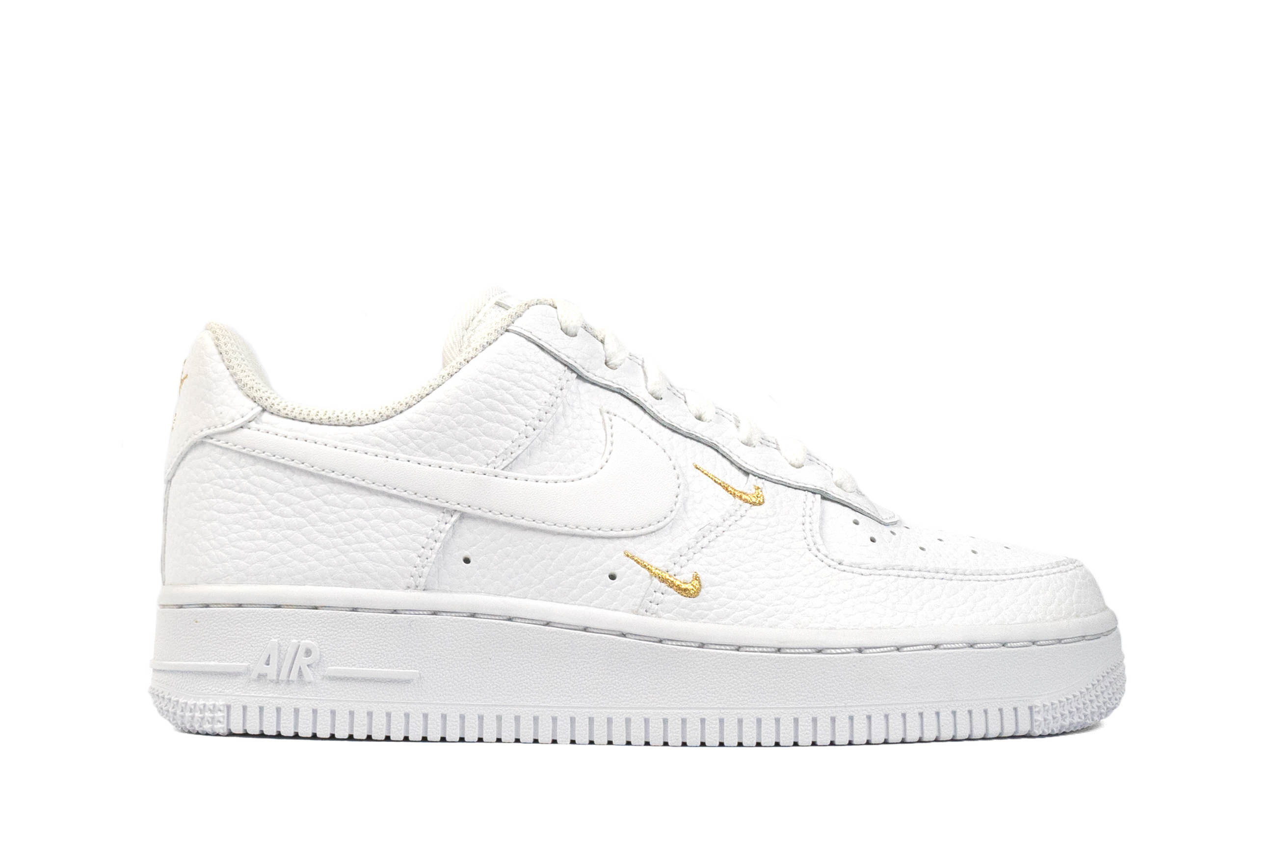 white nikes with gold swoosh